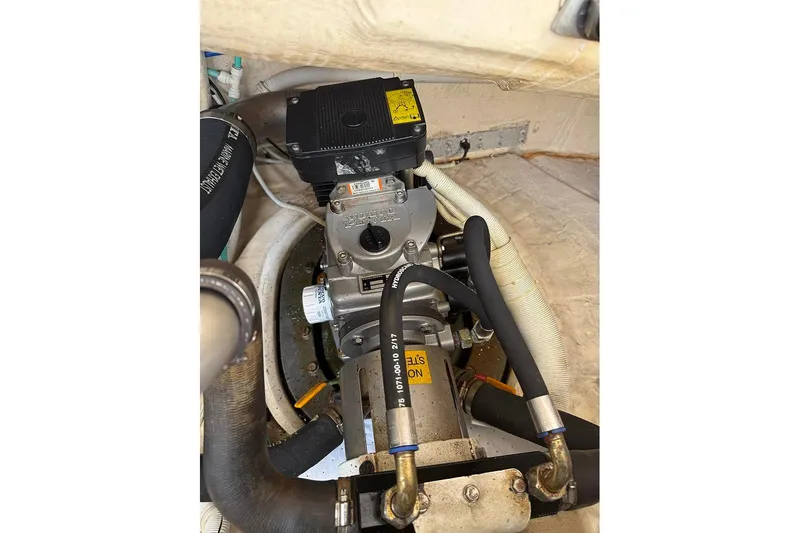 Ritz Karllton Too Yacht Photos Pics Engine compartment of a 2008 Tiara Yachts 3900 Sovran, showcasing mechanical components and hoses.