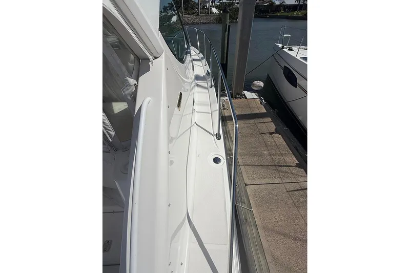 Ritz Karllton Too Yacht Photos Pics 2008 Tiara Yachts 3900 Sovran docked, showcasing sleek side deck and railing.