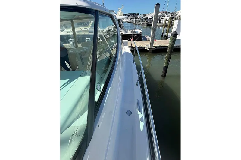 Ritz Karllton Too Yacht Photos Pics 2008 Tiara Yachts 3900 Sovran docked at marina, side view with railing.