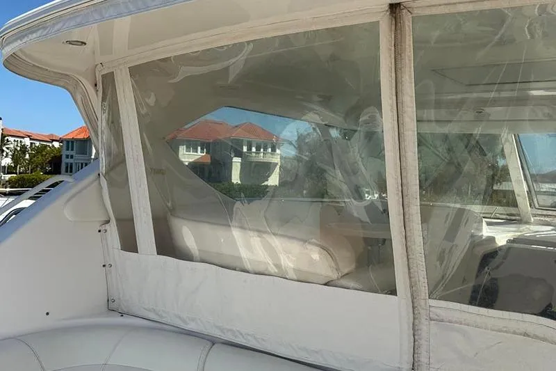 Ritz Karllton Too Yacht Photos Pics 2008 Tiara Yachts 3900 Sovran interior with clear enclosure and scenic background.