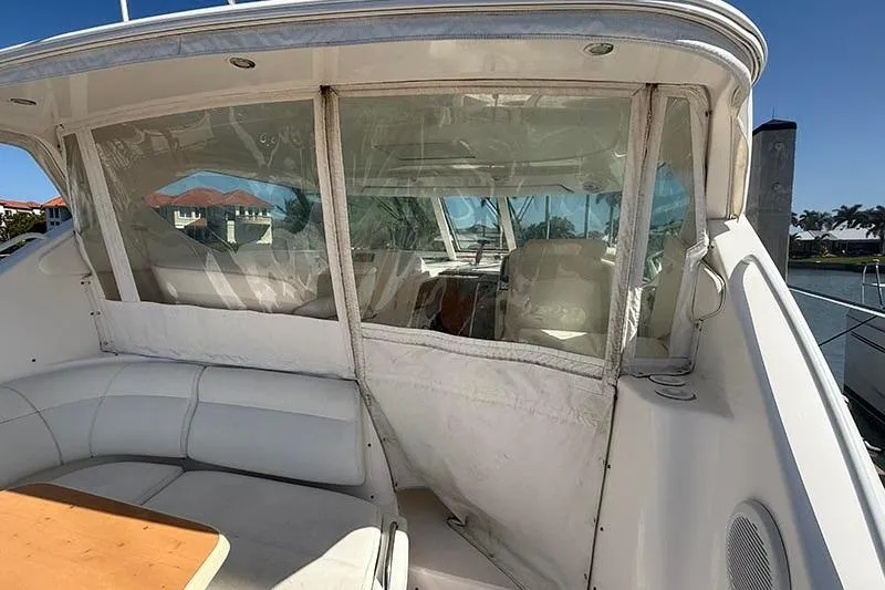 Ritz Karllton Too Yacht Photos Pics 2008 Tiara Yachts 3900 Sovran cockpit with white seating and clear enclosure.