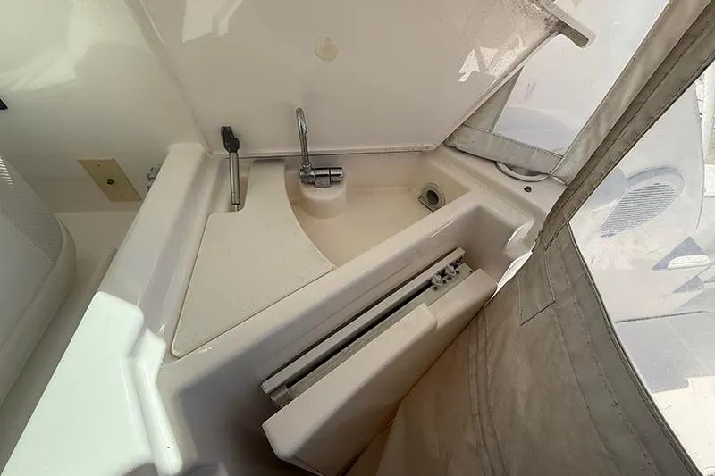 Ritz Karllton Too Yacht Photos Pics 2008 Tiara Yachts 3900 Sovran sink area with faucet and storage compartment.