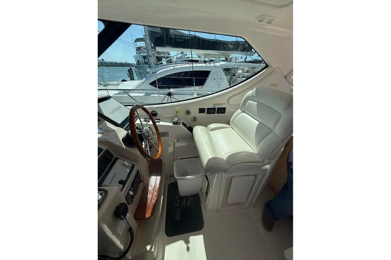Ritz Karllton Too Yacht Photos Pics Interior of 2008 Tiara Yachts 3900 Sovran, featuring helm and leather seating.