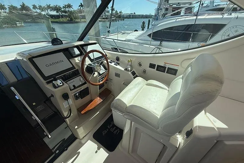 Ritz Karllton Too Yacht Photos Pics 2008 Tiara Yachts 3900 Sovran helm with Garmin navigation, luxurious seating, and waterfront view.
