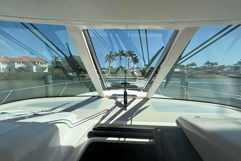 Ritz Karllton Too Yacht Photos Pics 2008 Tiara Yachts 3900 Sovran cockpit view with waterfront and palm trees.