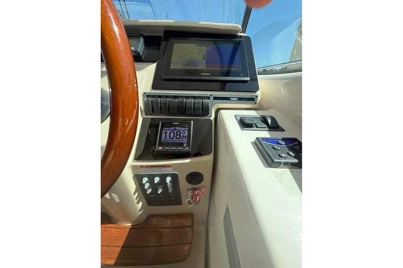 Ritz Karllton Too Yacht Photos Pics 2008 Tiara Yachts 3900 Sovran helm with navigation controls and display screens.