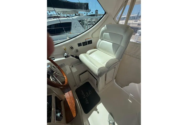 Ritz Karllton Too Yacht Photos Pics 2008 Tiara Yachts 3900 Sovran helm with leather seat and wooden steering wheel.