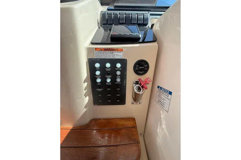 Ritz Karllton Too Yacht Photos Pics Control panel of a 2008 Tiara Yachts 3900 Sovran, featuring switches and warning labels.