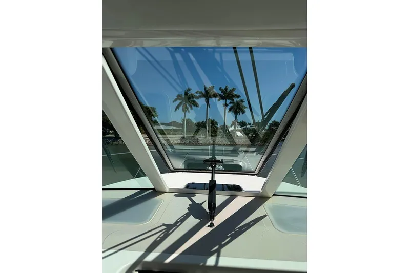 Ritz Karllton Too Yacht Photos Pics View from 2008 Tiara Yachts 3900 Sovran cockpit, showcasing palm trees through the windshield.