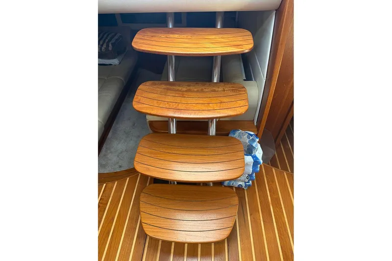 Ritz Karllton Too Yacht Photos Pics Wooden steps inside 2008 Tiara Yachts 3900 Sovran, showcasing elegant interior design.