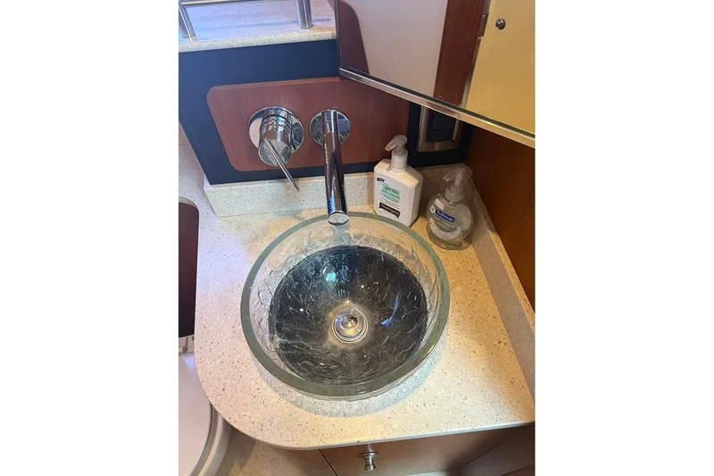 Ritz Karllton Too Yacht Photos Pics Glass sink and faucet in 2008 Tiara Yachts 3900 Sovran bathroom.