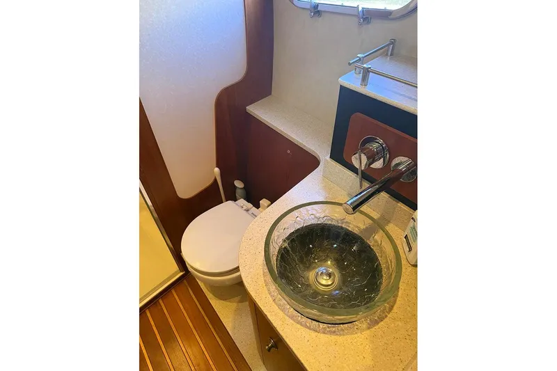 Ritz Karllton Too Yacht Photos Pics 2008 Tiara Yachts 3900 Sovran bathroom with glass sink and modern fixtures.