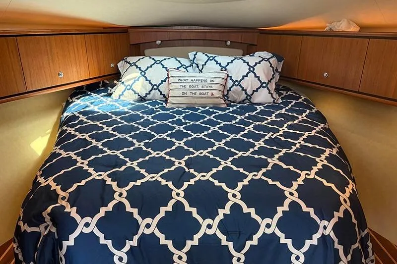 Ritz Karllton Too Yacht Photos Pics Cozy cabin bedroom in 2008 Tiara Yachts 3900 Sovran with patterned bedding.