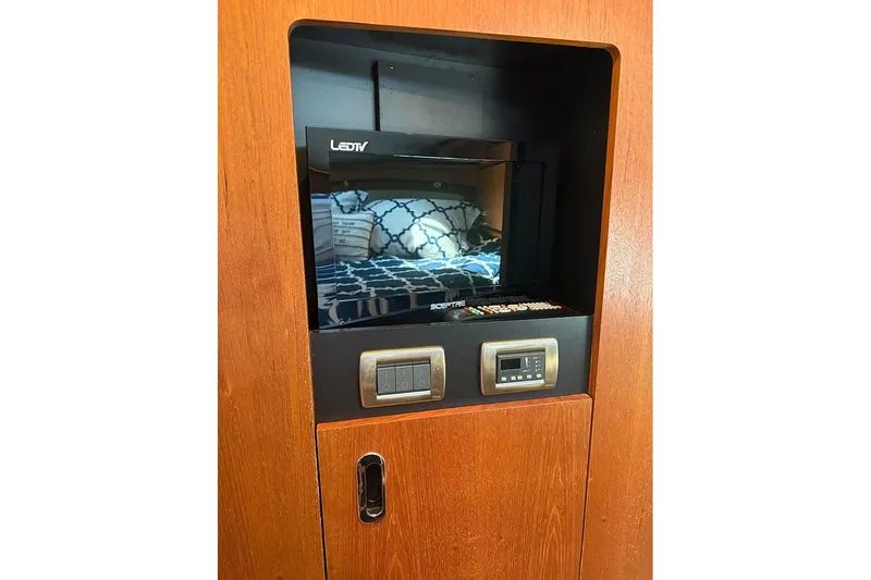 Ritz Karllton Too Yacht Photos Pics LED TV and control panel in 2008 Tiara Yachts 3900 Sovran interior.