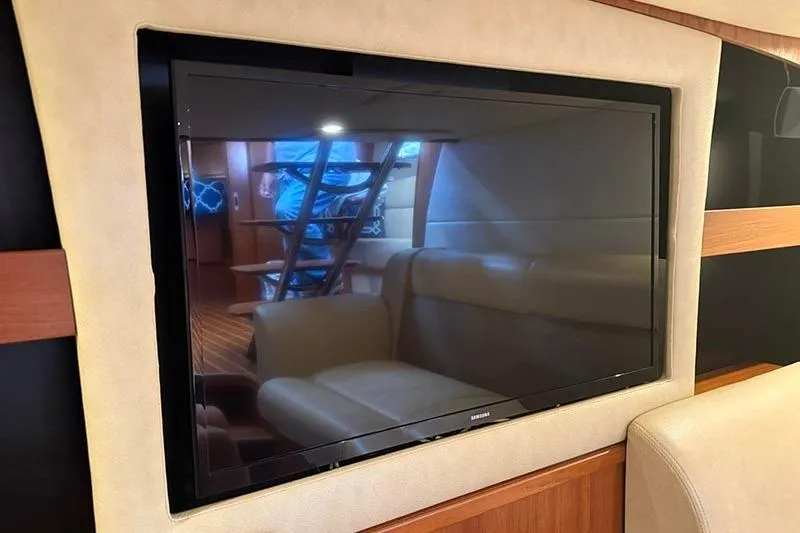 Ritz Karllton Too Yacht Photos Pics Flat-screen TV in the luxurious interior of a 2008 Tiara Yachts 3900 Sovran.