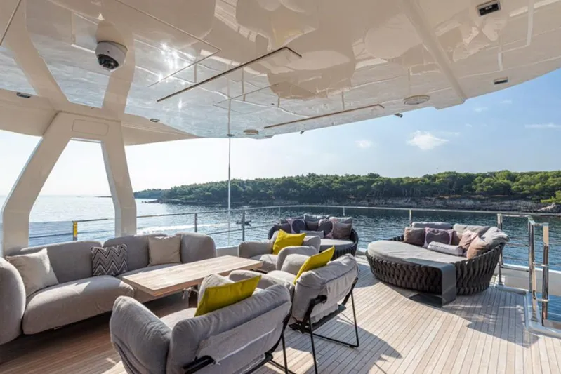 Newal Yacht Photos Pics Luxurious 2018 Custom Line Navetta 33 yacht deck with elegant seating and scenic ocean view.