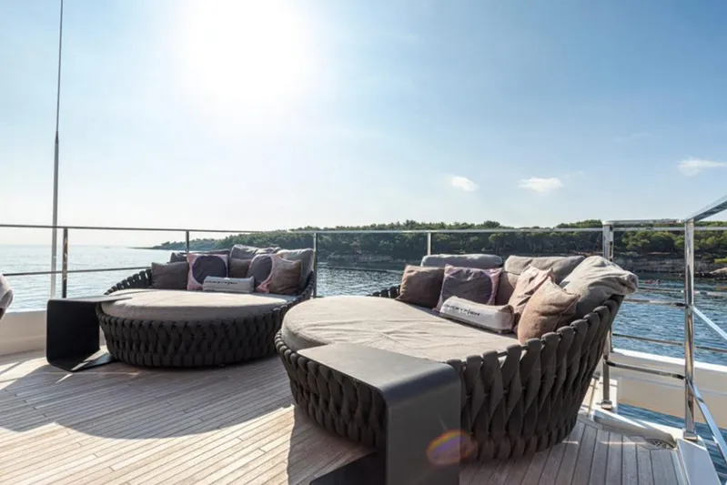 Newal Yacht Photos Pics Luxurious 2018 Custom Line Navetta 33 yacht deck with plush seating and ocean view.