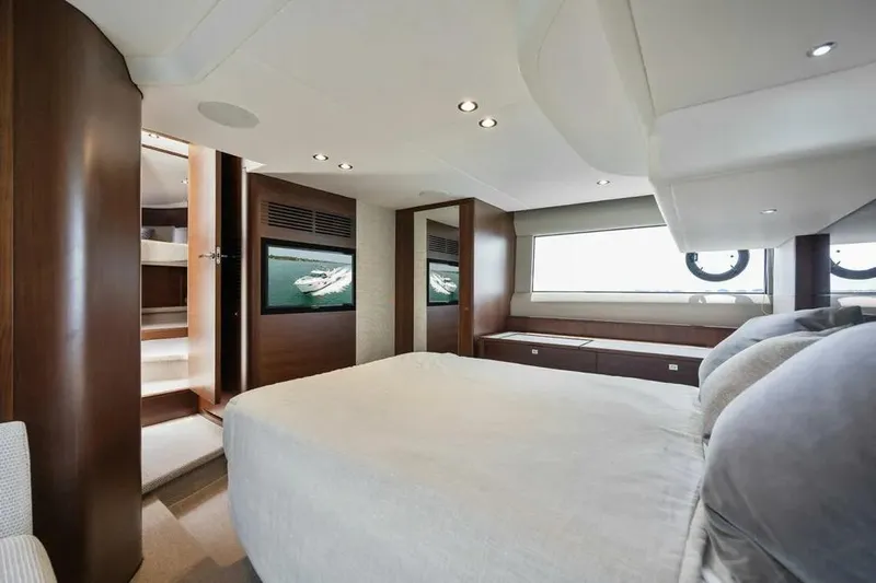  Yacht Photos Pics Luxurious bedroom interior of 2018 Princess F49 yacht with modern design and large window.