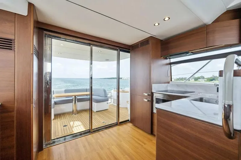  Yacht Photos Pics Luxurious interior of 2018 Princess F49 yacht with ocean view and modern kitchen.