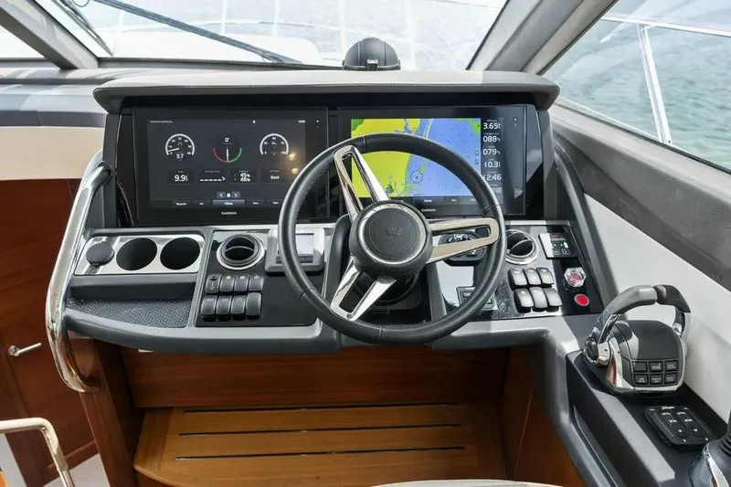  Yacht Photos Pics Cockpit of 2018 Princess F49 yacht with modern navigation and control systems.