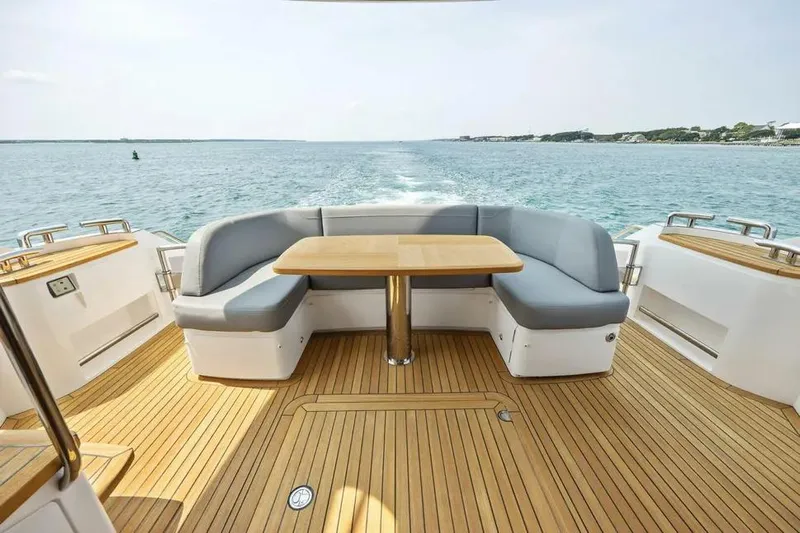  Yacht Photos Pics Luxurious 2018 Princess F49 yacht deck with seating and ocean view.