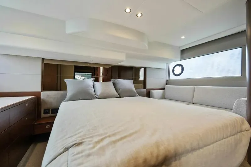  Yacht Photos Pics Luxurious interior of 2018 Princess F49 yacht with elegant bedding and modern design.