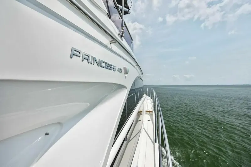  Yacht Photos Pics 2018 Princess F49 yacht cruising on open water under a clear sky.