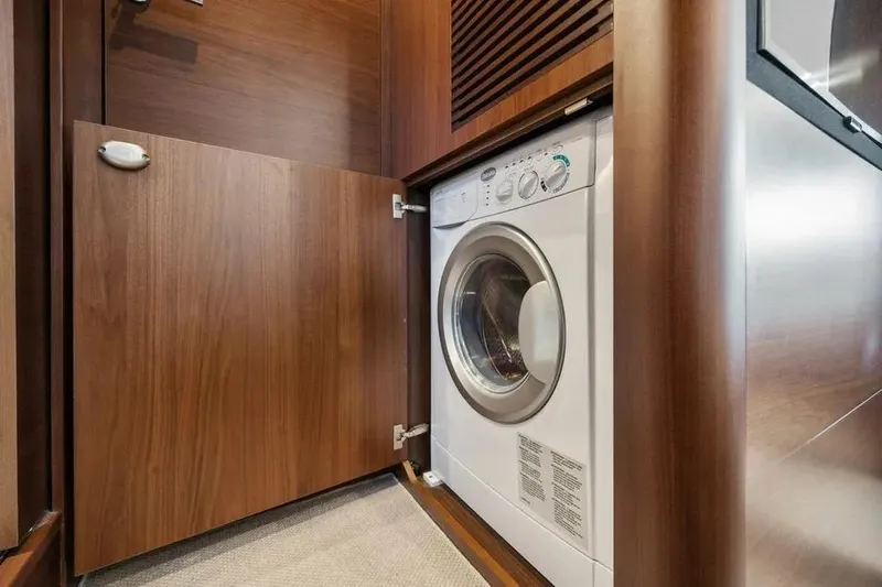  Yacht Photos Pics Washing machine in wooden cabinet on 2018 Princess F49 yacht.