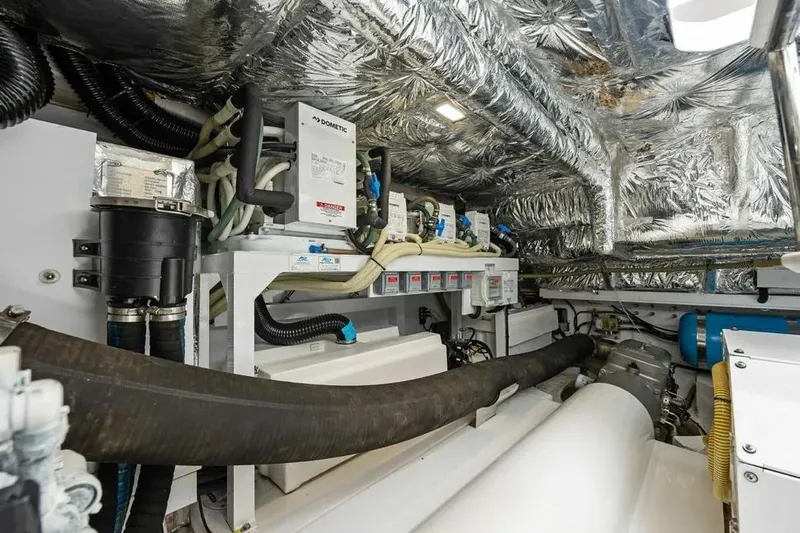  Yacht Photos Pics Engine room of 2018 Princess F49 yacht with insulated walls and mechanical components.