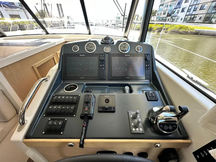 My Ty Yacht Photos Pics 2023 Beneteau Swift Trawler 48 helm with dual screens and control panel.