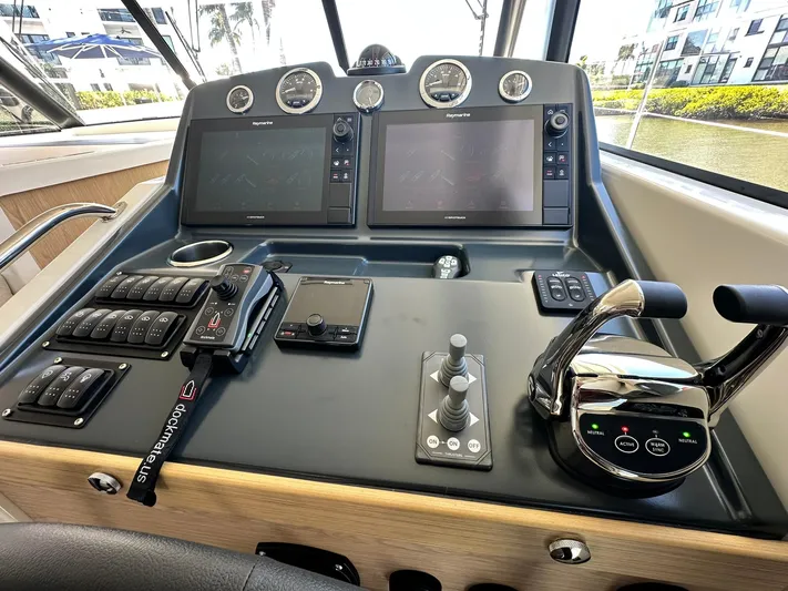 My Ty Yacht Photos Pics 2023 Beneteau Swift Trawler 48 helm with dual screens and control panel.