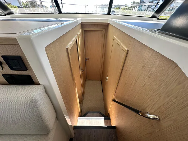 My Ty Yacht Photos Pics Interior of 2023 Beneteau Swift Trawler 48, featuring wooden doors and modern design.