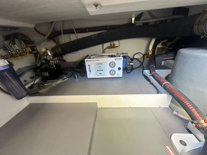 My Ty Yacht Photos Pics 2023 Beneteau Swift Trawler 48 engine room with equipment and wiring.