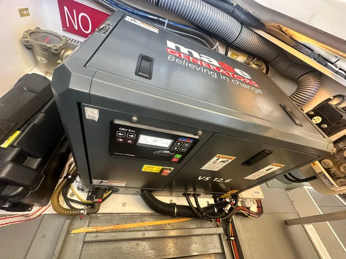 My Ty Yacht Photos Pics 2023 Beneteau Swift Trawler 48 engine room with generator and wiring.