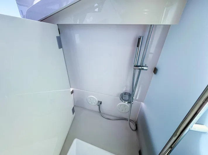  Yacht Photos Pics 2024 Axopar 37XC CROSS CABIN BRABUS Trim interior shower area with sleek design.