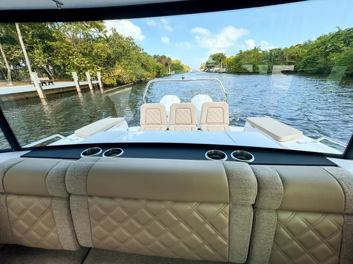  Yacht Photos Pics 2024 Axopar 37XC CROSS CABIN BRABUS Trim interior with luxurious seating, river view.