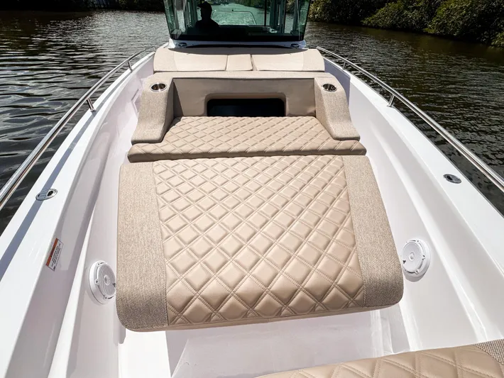  Yacht Photos Pics 2024 Axopar 37XC CROSS CABIN BRABUS Trim with luxurious quilted seating on a serene waterway.