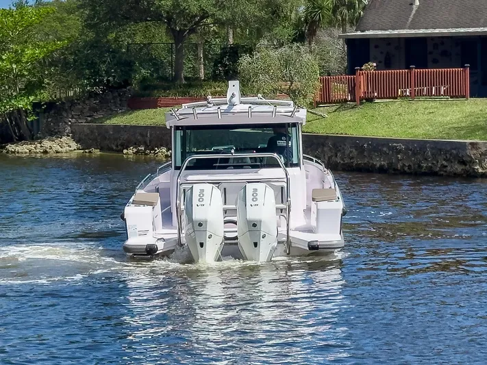  Yacht Photos Pics 2024 Axopar 37XC CROSS CABIN BRABUS Trim boat on a scenic waterway.