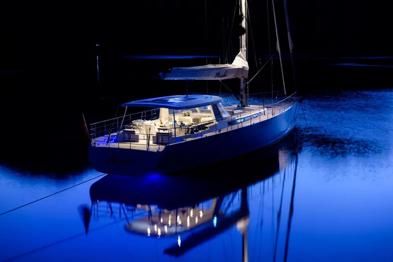Mishi Yacht Photos Pics Luxurious Custom Mishi 88 yacht, 2018 model, illuminated on calm water at night.
