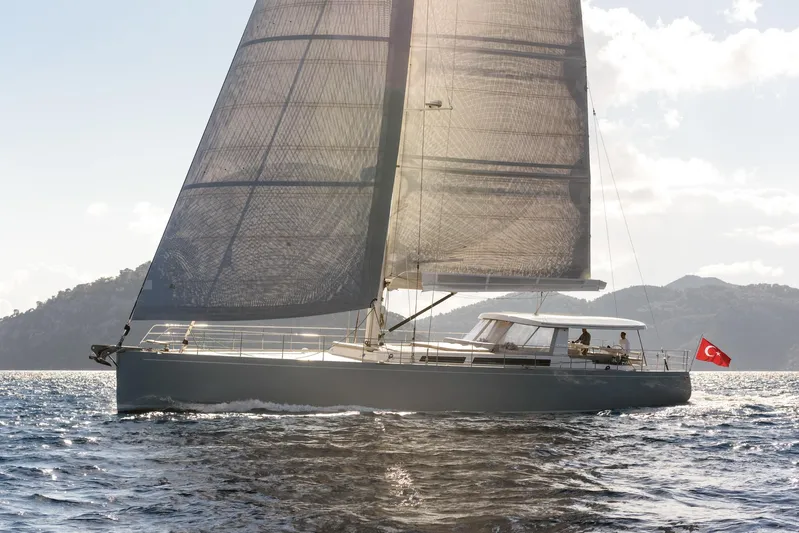 Mishi Yacht Photos Pics Sailing yacht "Mishi 88" gliding on water, Turkish flag, sunny day, 2018 model.