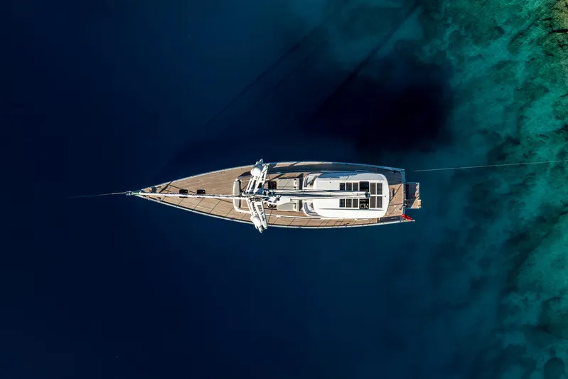 Mishi Yacht Photos Pics Aerial view of Custom Mishi 88 yacht on clear blue water, 2018 model.