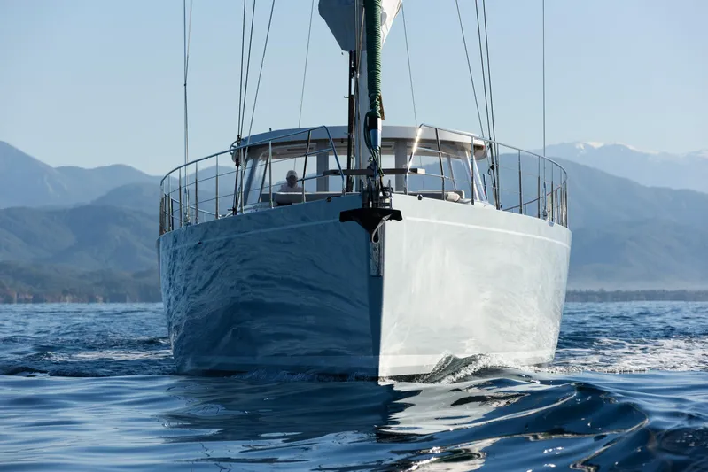 Mishi Yacht Photos Pics Custom Mishi 88 yacht sailing on calm waters with mountainous backdrop, 2018 model.