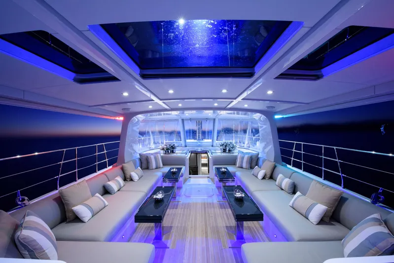 Mishi Yacht Photos Pics Luxurious interior of 2018 Custom Mishi 88 yacht with modern seating and ambient lighting.