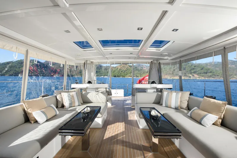 Mishi Yacht Photos Pics Luxurious interior of 2018 Custom Mishi 88 yacht with elegant seating and scenic ocean view.