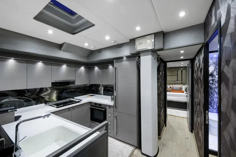 Mishi Yacht Photos Pics Luxurious modern kitchen interior in 2018 Custom Mishi 88 yacht, featuring sleek design and appliances.