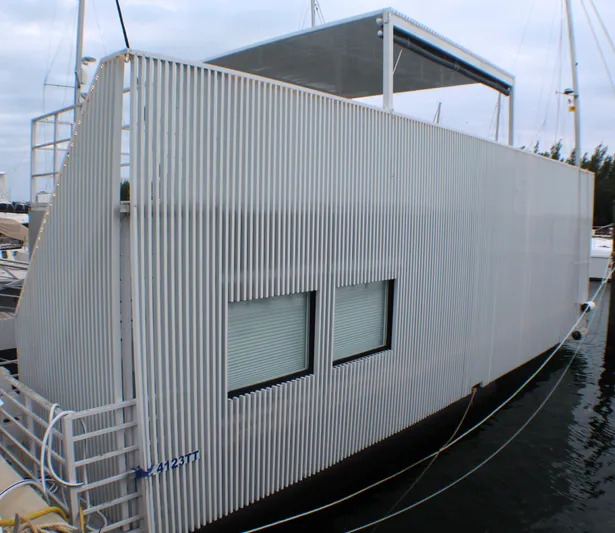  Yacht Photos Pics Modern Struktures MS 400 houseboat, 2023 model, with sleek corrugated exterior design.