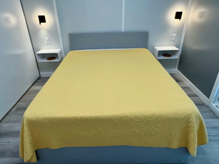  Yacht Photos Pics Modern bedroom with yellow bedspread, wall sconces, and floating nightstands, Modern Struktures MS 400, 2023.