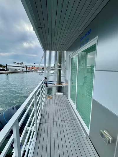  Yacht Photos Pics Modern Struktures MS 400 houseboat deck with waterfront view, 2023 model.