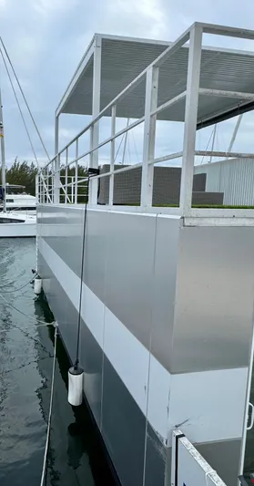  Yacht Photos Pics Modern Struktures MS 400 floating structure, 2023 model, docked on water.