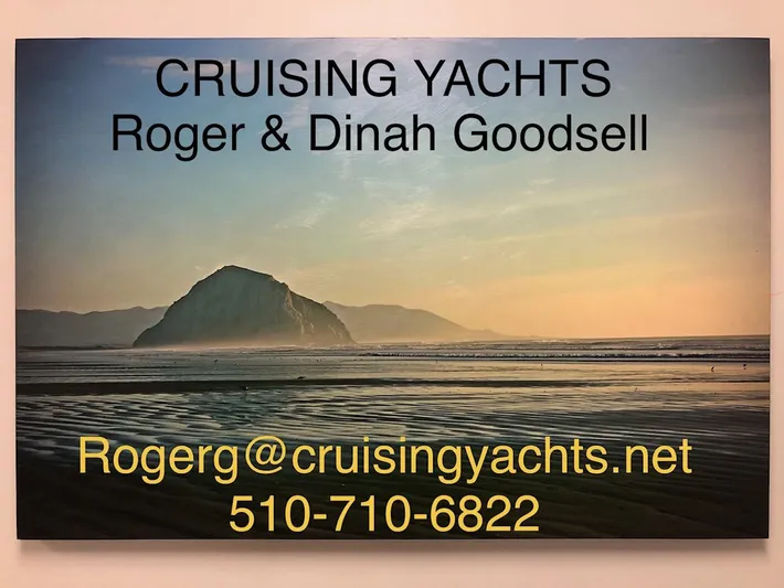 Snug Harbor Yacht Photos Pics Cruising Yachts contact information with scenic coastal background, Catalina 470, 2002 model.